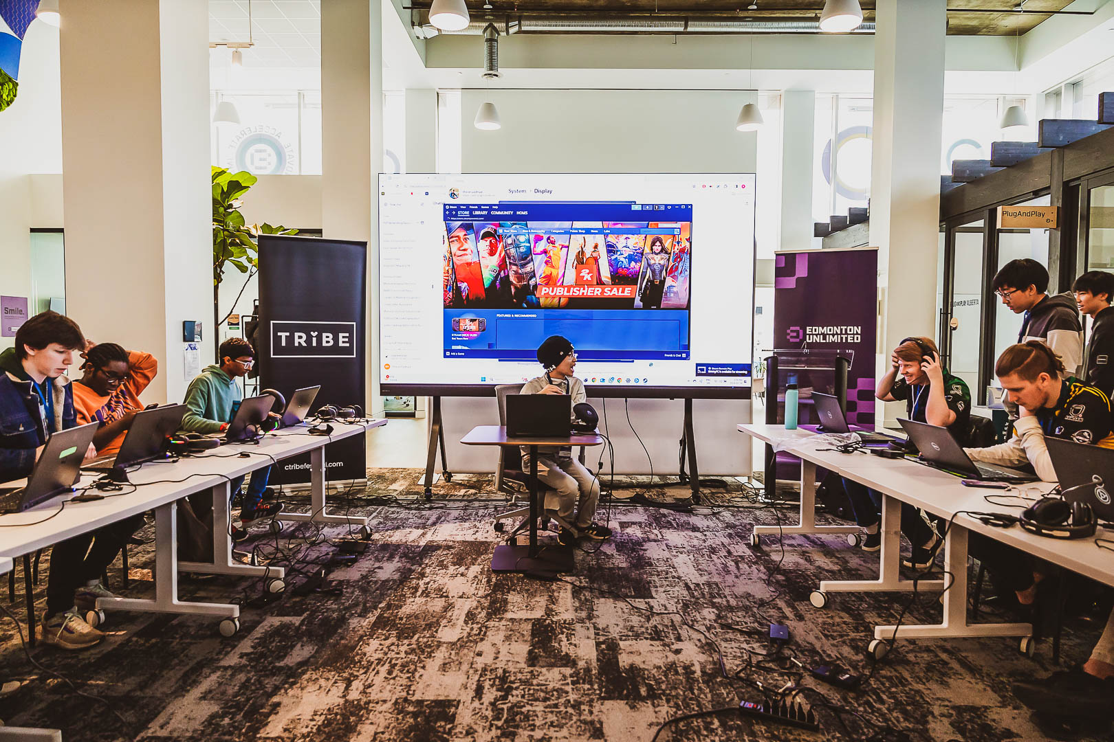 Young players competing at C-Tribe x Gaming